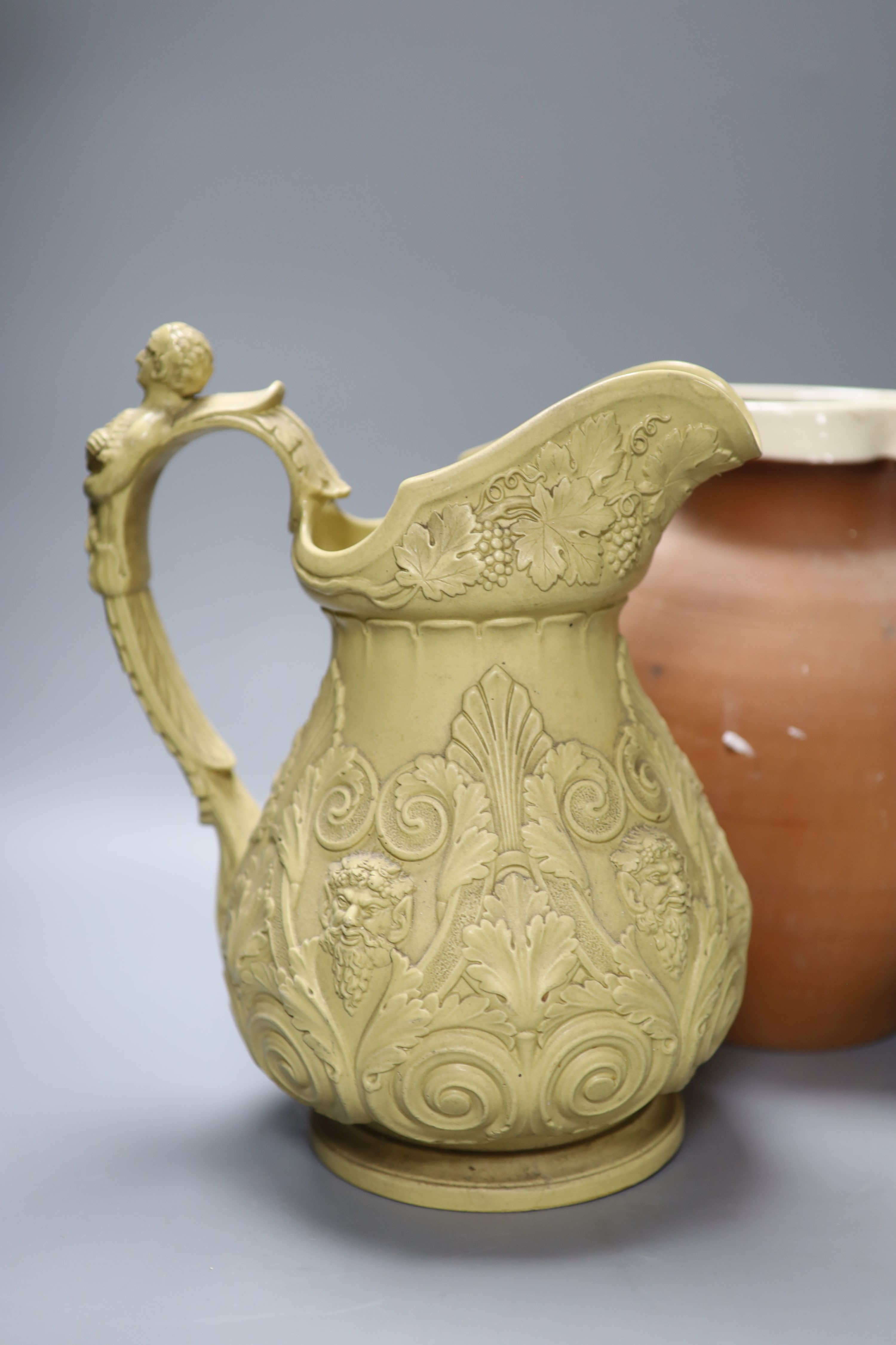 An ornate 19th century jug, another and a cream glazed Worcester jug, tallest 29cm